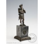 A bronze figure of a Gordon Highlander, modelled standing on a block plinth base,