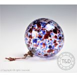 An early 20th century mottled glass witches ball or bauble,