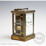 A Mappin and Webb brass carriage clock, with Roman numeral dial and movement striking on a gong, 14.