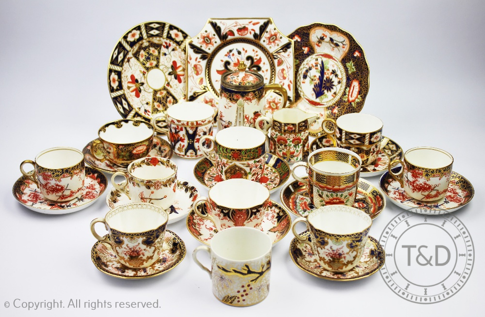 A collection of tea and coffee wares decorated in the imari palette to include a Royal Crown Derby