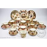 A collection of tea and coffee wares decorated in the imari palette to include a Royal Crown Derby
