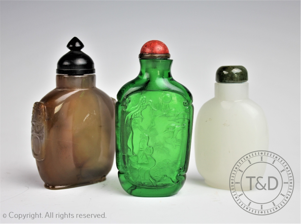 Three Chinese snuff bottles comprising; an opaline glass example with jade cover, 6.