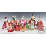A collection of eight Royal Doulton figures, comprising Southern Belle HN2229 (x2), Rose HN1368,