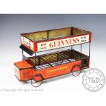 A 1960's Guinness novelty advertising bottle rack designed as a Omnibus,