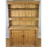 A 19th century style pine kitchen dresser, the raised back with three drawers,