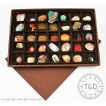 A tray containing a quantity of assorted agate plaques and mineral specimens, to include crystals,