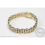 A 9ct yellow gold bracelet, with brick link detail and integral clasp with double safety catch,