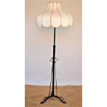 An Art Nouveau brass standard lamp, now painted black,