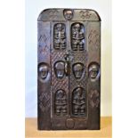 A West African carved hardwood grain store door, Fang or Dogon tribe,