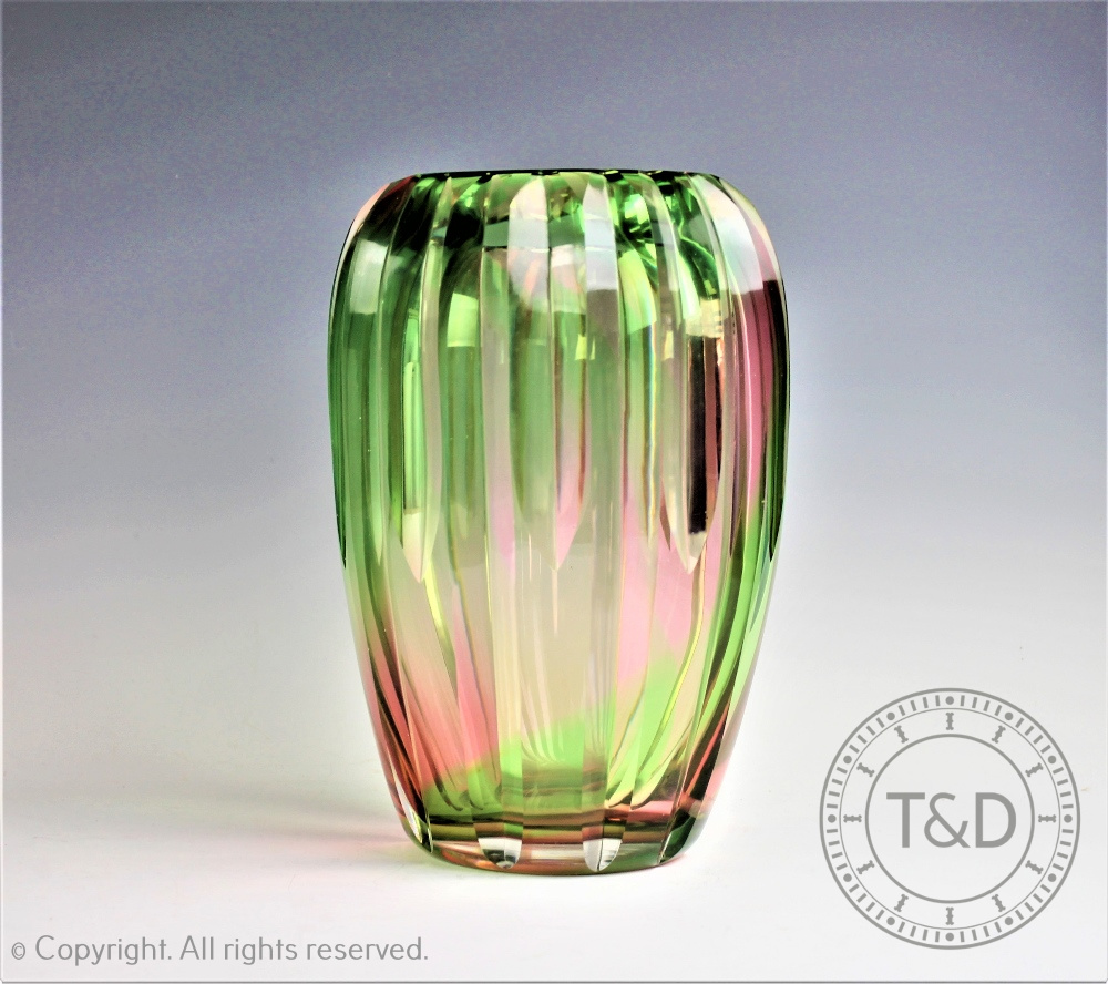 A Keith Murray for Stevens and William glass rainbow vase, with cut detailing,