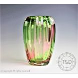 A Keith Murray for Stevens and William glass rainbow vase, with cut detailing,
