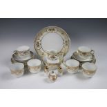 A Japanese Noritake tea service comprising; six teacups and saucers, six plates, a serving plate,