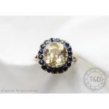 A citrine and sapphire set cluster ring,