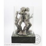 A modernist metal sculpture, by repute it represents man being trapped by technology,
