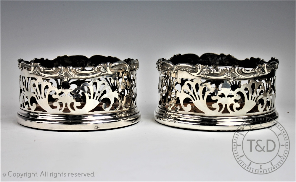 A pair of 19th century silver plated bottle coasters,