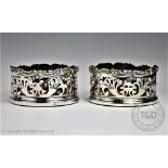 A pair of 19th century silver plated bottle coasters,