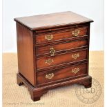 A George III style mahogany chest, of four long drawers, on bracket feet, 64cm H x 59cm W x 39cm D,