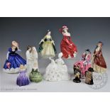 Eleven Royal Doulton figurines to include; Paisley Shawl HN1987, Belle HN2340, Marie HN1370,
