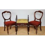 A part set of five Victorian walnut buckle back dining chairs, with upholstered seats,