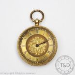 A gold fob watch, the case with decorative floral engraving,