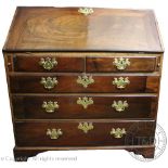 A George III style mahogany bureau, with fall enclosing a fitted interior,