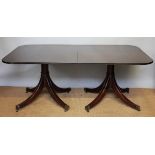 A Regency style mahogany twin pillar dining table,