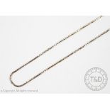 A fine white metal box link chain, with bolt rings clasp, stamped '750', weight 3gms,