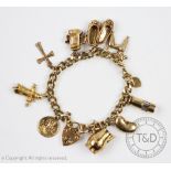 A 9ct yellow gold charm bracelet, the curb link bracelet hung with ten charm,