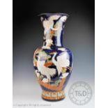 A 20th century Chinese earthenware floor vase, decorated with cranes,
