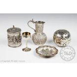 A selection of five white metal objects of virtue to include an Indian silver cylindrical caddy and
