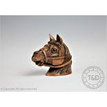 A late Victorian carved walnut novelty inkwell, modelled as a horses head, with glass eyes,