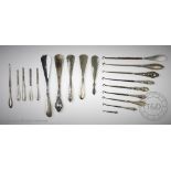 A collection of silver handled shoe horns,