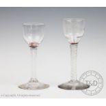 Two George III double opaque air twist wine glasses,