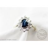 A sapphire and diamond oval cluster ring,