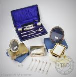 A cased silver manicure set, Chester 1920, to include, silver topped jars, buffers, tools,