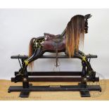 A modern painted dappled black rocking horse,