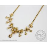 A Victorian split seed pearl set necklace,