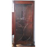 A modern George III style mahogany corner cabinet, with one astragal glazed door, on bracket feet,