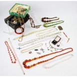 A quantity of assorted costume jewellery, beads, earrings, a charm bracelet,