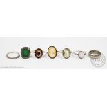 A collection of seven rings, to include; a 9ct gold garnet set ring, 3.