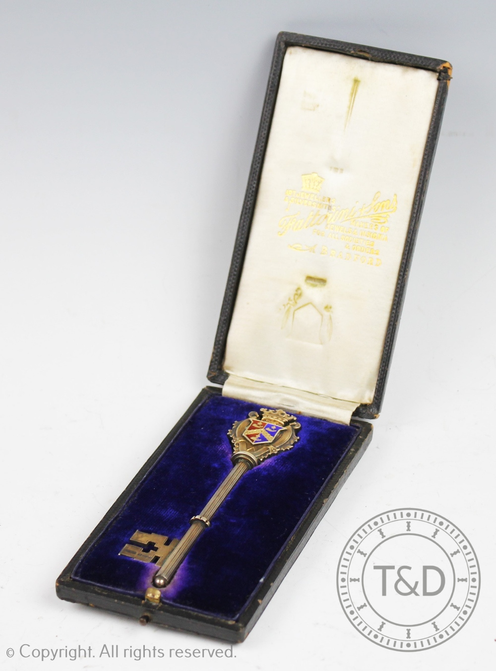 A silver gilt and enamel presentation key, Fattorini & Sons, Birmingham 1909,