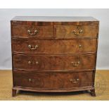 A late George III mahogany bow front chest, with two short and three graduated drawers,