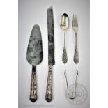 A small selection of silver to include a pair of sugar nips,