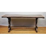 An 18th century style rustic oak refectory table, two plank top with cleated ends,