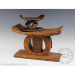 A West African tribal art Ashanti Ghana carved wooden stool, carved with 'CLAN MCLAREN', 36cm wide,