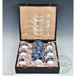 A case Wedgwood coffee service in the Blue Siam pattern comprising six coffee cups and saucers,