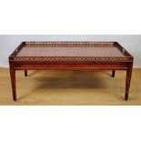 A reproduction mahogany coffee table, of George III style, with pierced gallery , on tapered legs,