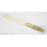 A late 19th century carved French Dieppe ivory page turner,