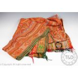 A machine woven Paisley shawl, worked with a bold symmetrical pattern,