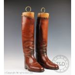 A pair of gentlemans leather riding boots and boot trees, each tan leather boot stamped Lobb,